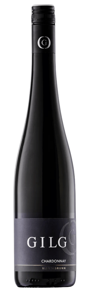 Eine dunkle Glasflasche GILG Chardonnay mit schwarzem Etikett und silbernem Text, gekrönt von einem versiegelten schwarzen Deckel mit silbernem G-Logo.