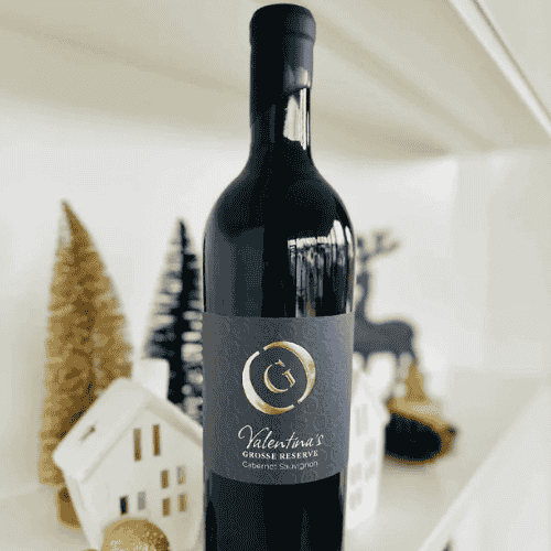 Valentina´s Große Reserve Cabernot, schwarze Flasche mit weihnachtlichen Hintergrund